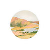 Round decorative coaster by Margaret Jeane featuring an impressionistic landscape painting.