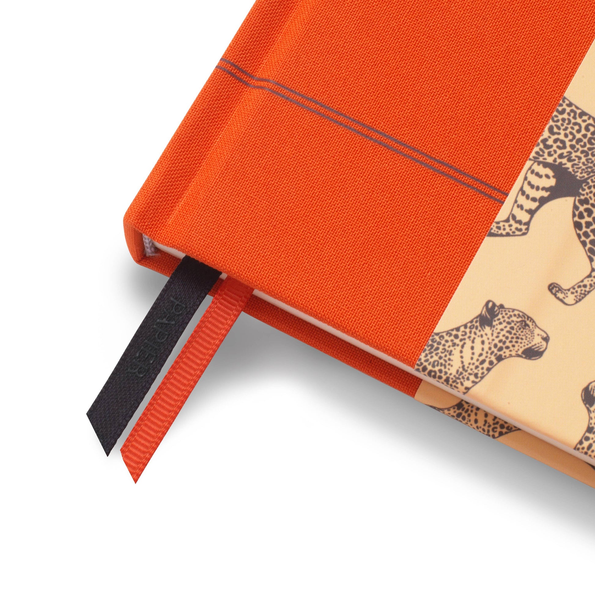 Orange fabric journal by Papier featuring a leopard print design, with a black and orange ribbon bookmark.