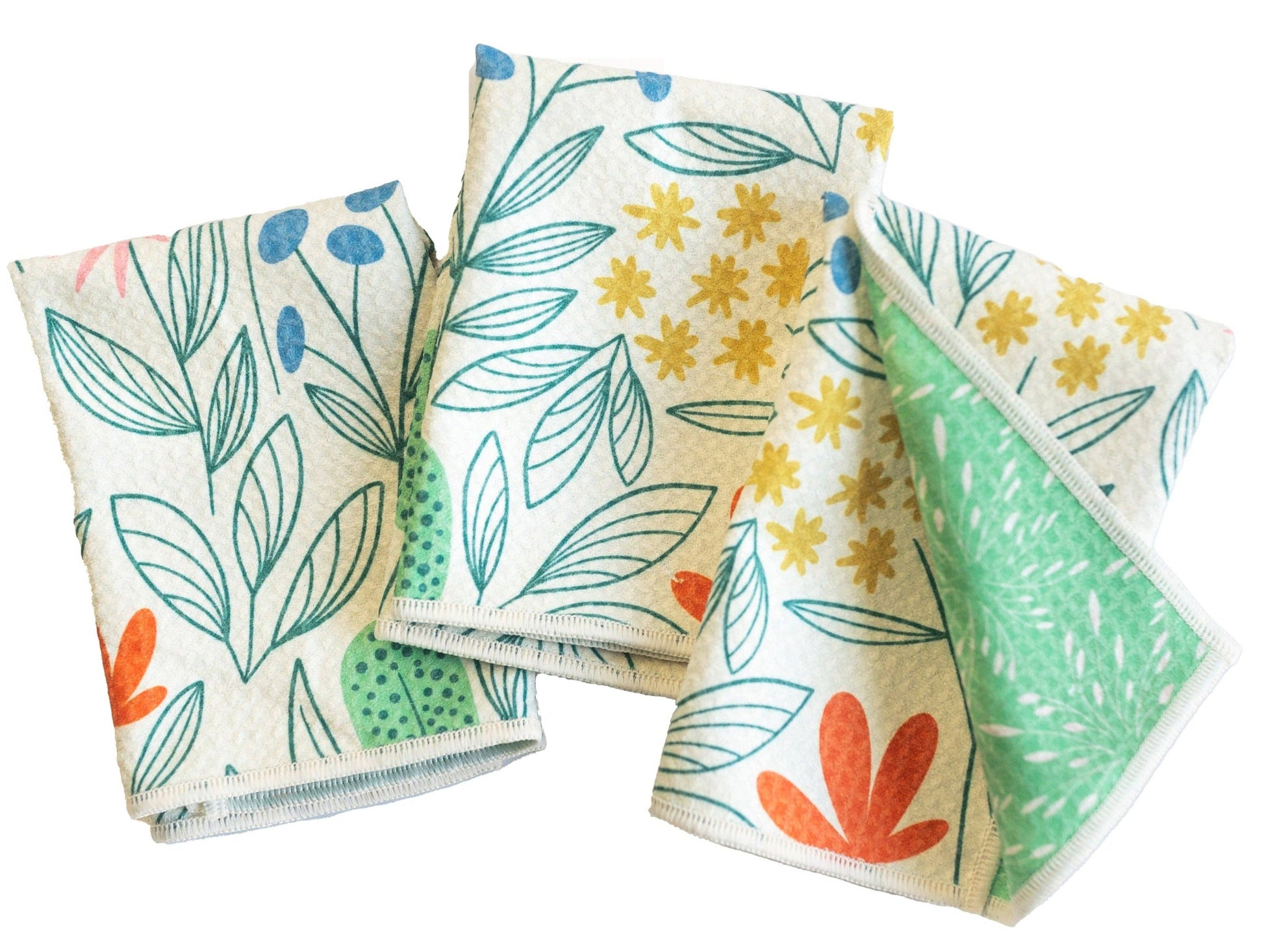 Set of three cream-colored Mighty Mini towels from RJW, patterned with colorful botanical illustrations.
