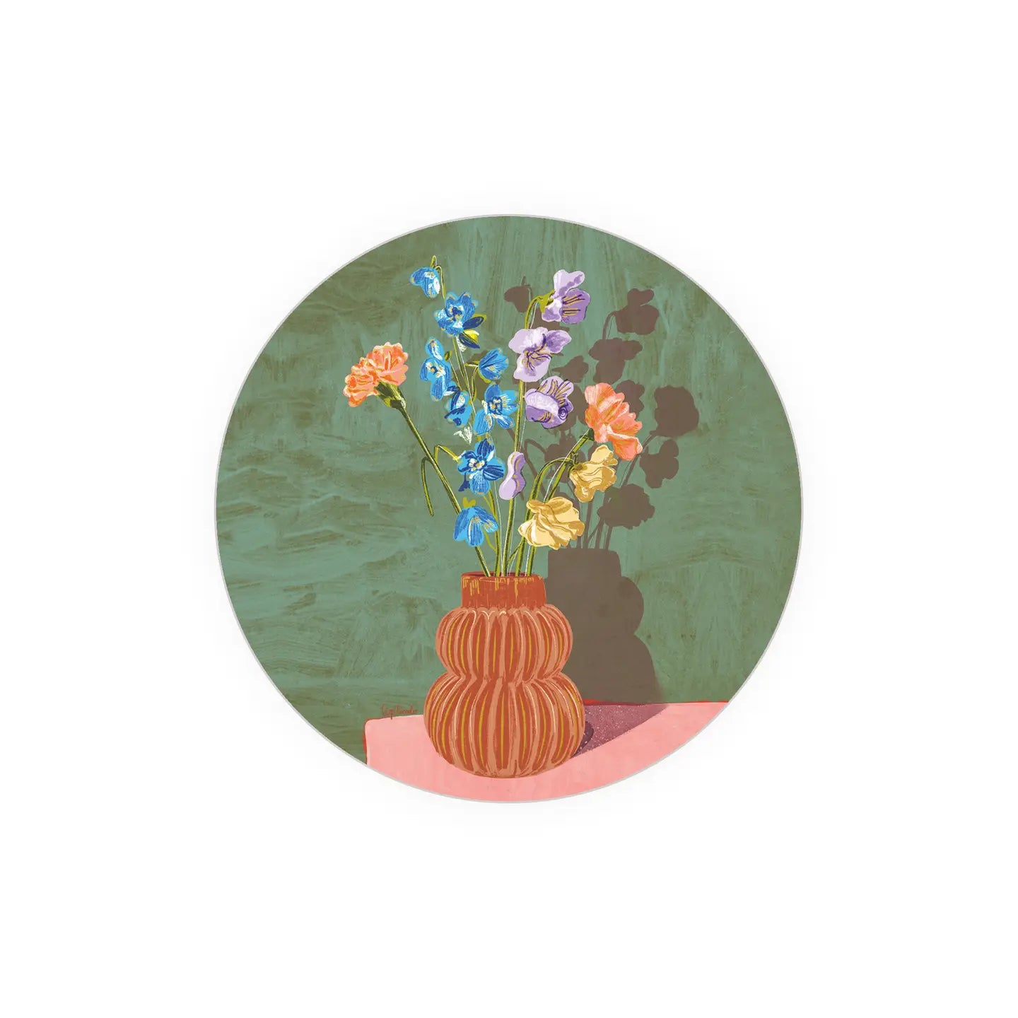 Round floral coaster with colorful flower arrangement over a pink surface.