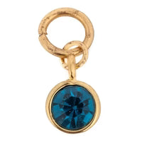 Gold-toned gemstone charm by Nomination with a blue crystal accent.
