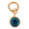 Gold-toned gemstone charm by Nomination with a blue crystal accent.
