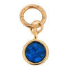 Blue gemstone charm by Thea with a gold-tone frame and loop connector.
