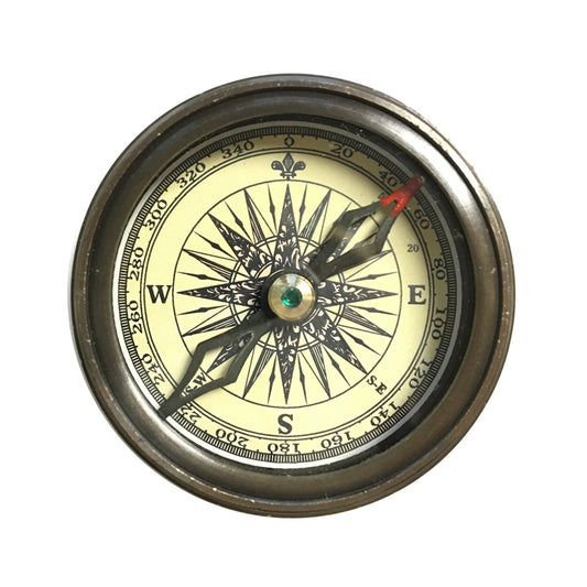 Antique-style compass with leather pouch by Walt Whitman, featuring a classic directional dial and aged metal casing.
