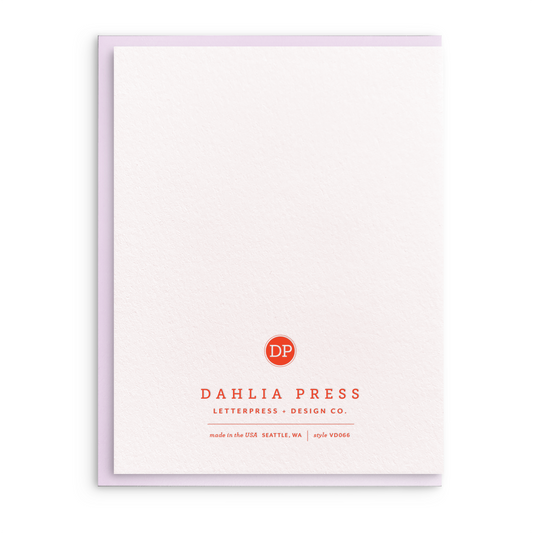 Blank greeting card by Dahlia Press with a textured surface and a lavender-colored edge.