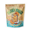 Island punch frozen cocktail by Noble Mick's, displayed in a tan and blue bag with tropical graphics.