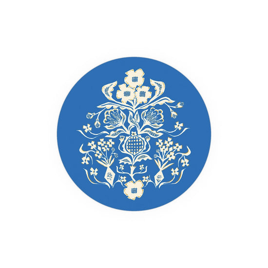 Blue and cream Seedlings Coaster with floral and pomegranate pattern.