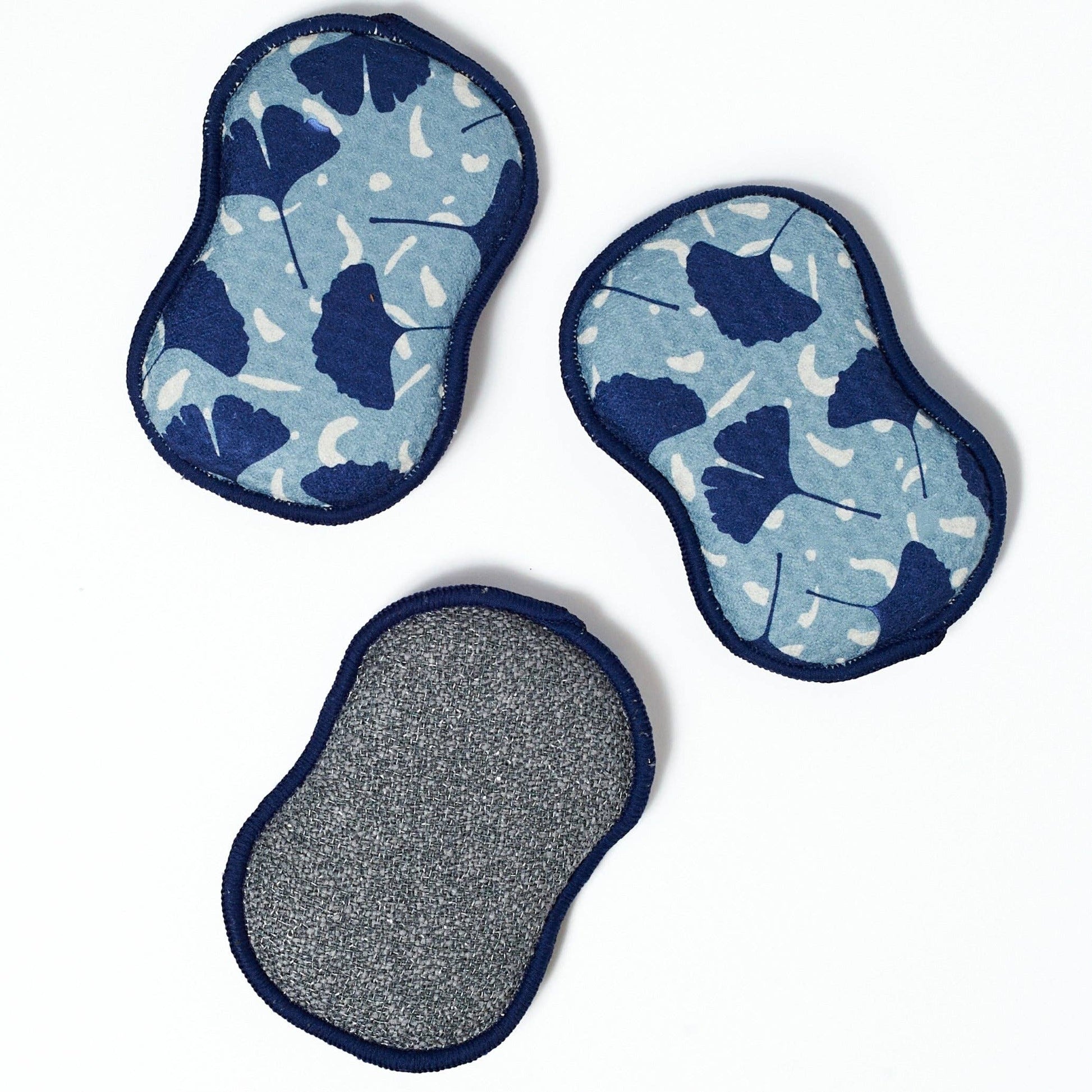 Set of three reusable sponges with blue ginko leaf pattern, one sponge features gray scrub texture.