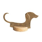 Hand-forged dachshund cheese knife of metal with a wooden base.
