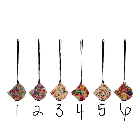 Set of six floral tape measures on a white background