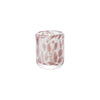 Glass with pink and white marbled pattern on a white background