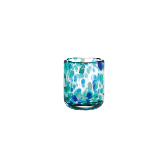Glass shot glass with blue and green pattern on a white background