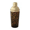 Tortoise shell cocktail shaker with confetti glass, with a gold lid.
