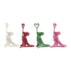 Enameled cast iron mouse place card holders in cream, red, green, and pink, each holding a wire heart.