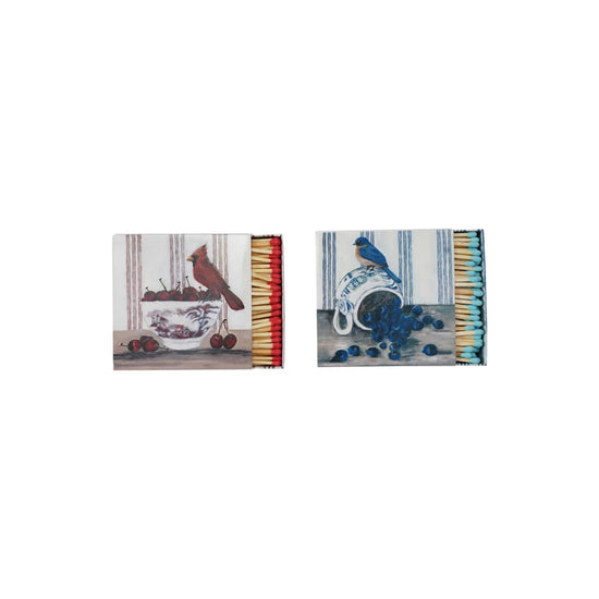 Bird safety matches with bird and fruit imagery, red and blue match heads.