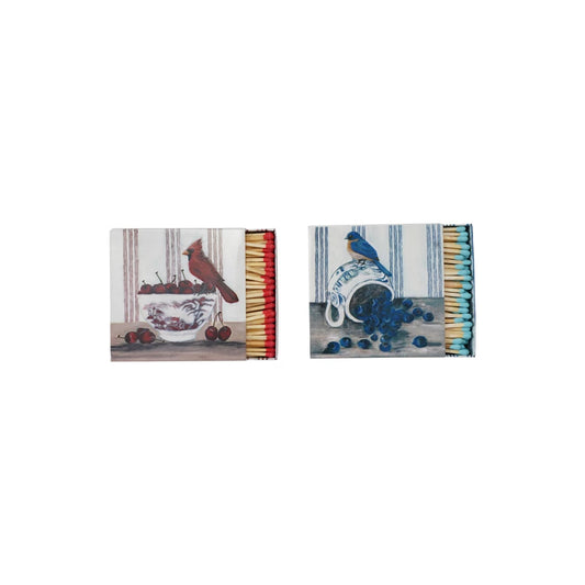 Bird safety matches with bird and fruit imagery, red and blue match heads.