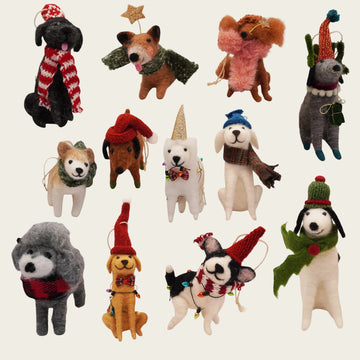 Christmas dog ornaments from felt material, decorated with festive accessories.