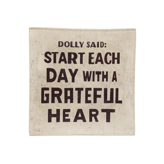 Small square decoupage plate with a quote by Dolly, featuring a cream background and distressed finish.
