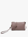 Dark mauve crossbody wristlet by unknown vendor with visible textured surface, gold hardware, and wrist strap.
