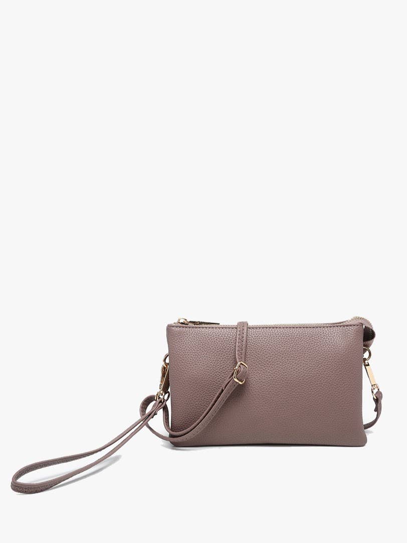 Dark mauve crossbody wristlet by unknown vendor with visible textured surface, gold hardware, and wrist strap.
