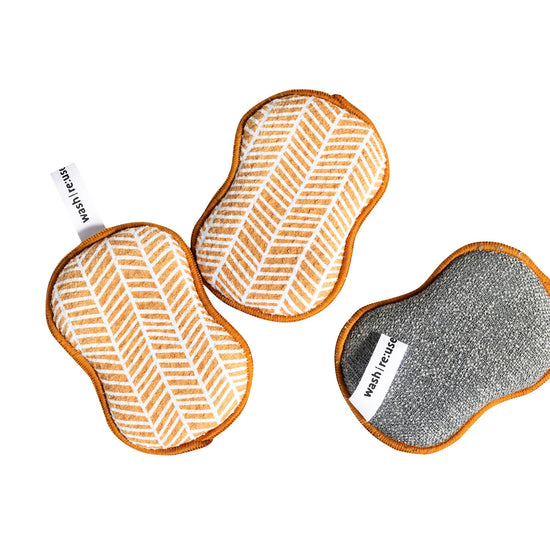 Reusable sponge set of three by RE:Use, featuring a branch pattern in gold with tan trim.