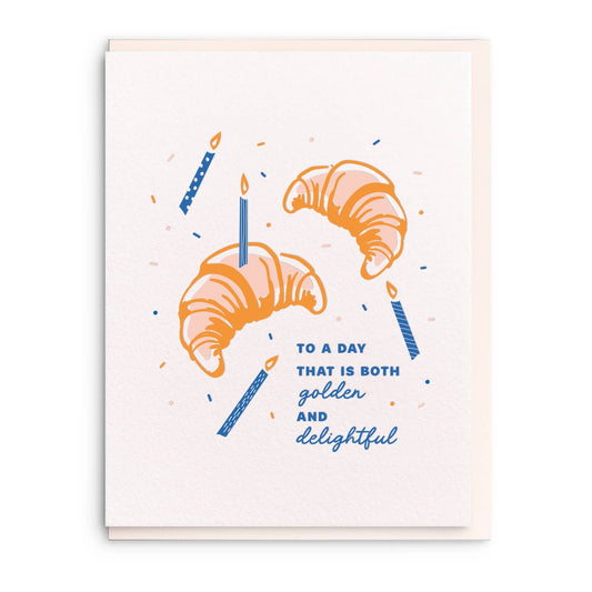 Letterpress birthday greeting card with croissant design by Sesame Letterpress, featuring blue candles and confetti details.