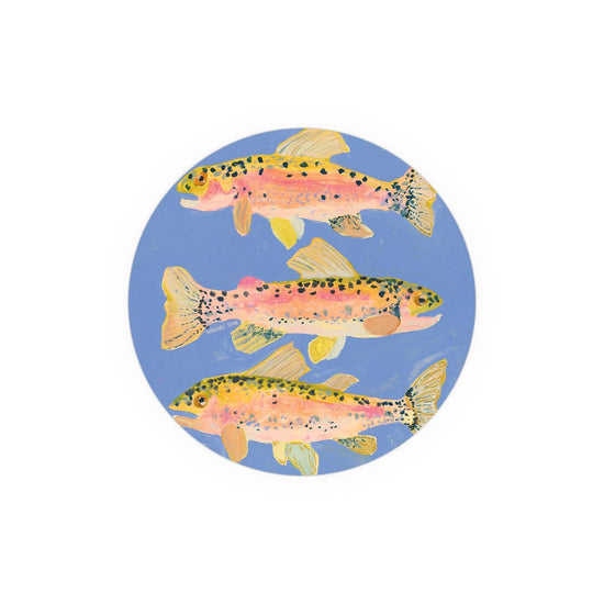 Round printed coaster by Margaret Steine showing three colorful trout swimming in a blue circle.
