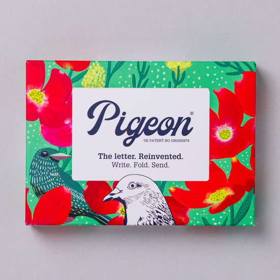 Foldable stationery set by Pigeon, featuring a vibrant floral and bird pattern on a green background.
