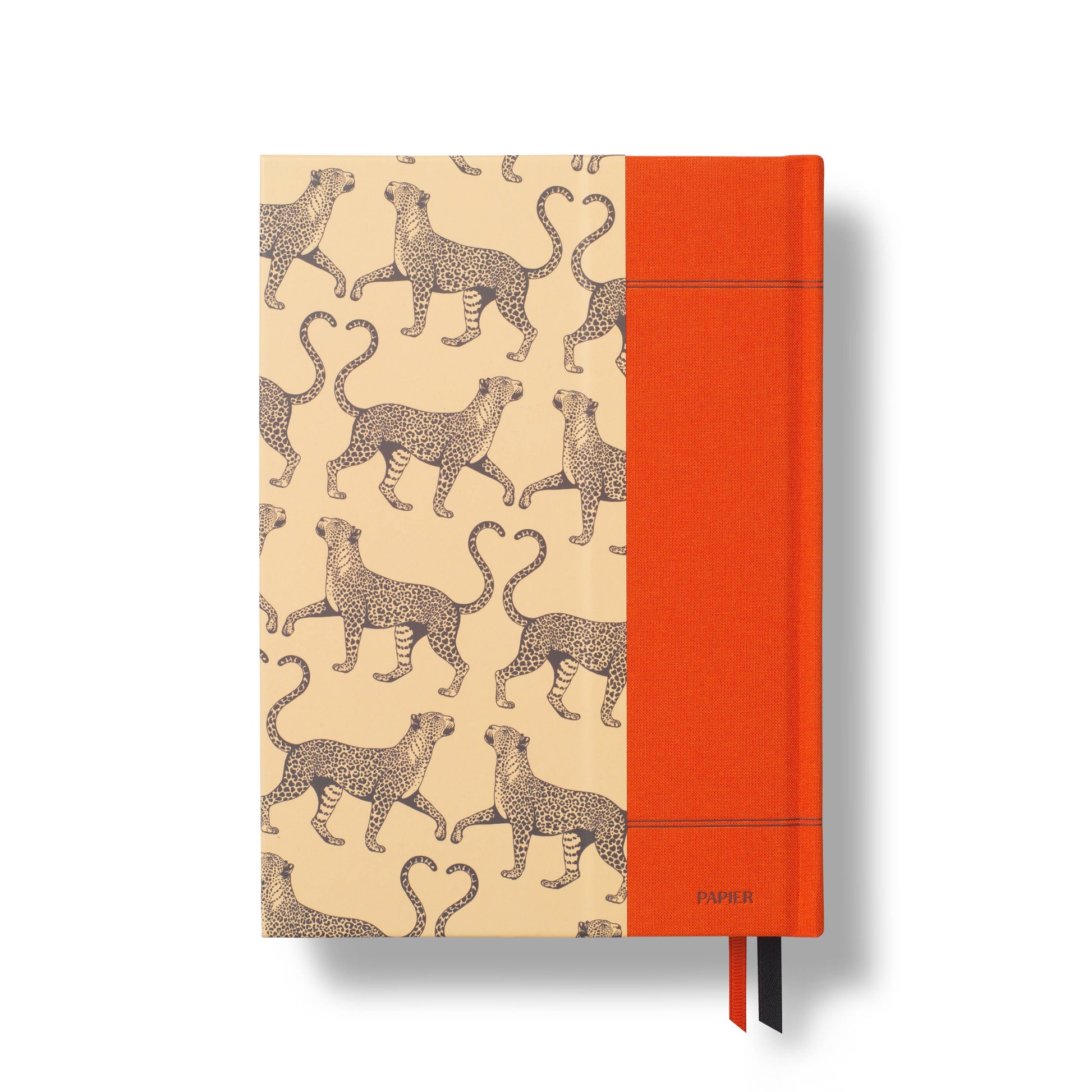 A5 fabric reading journal with a tails and hearts pattern by Papier, shown with an orange fabric spine and page markers.