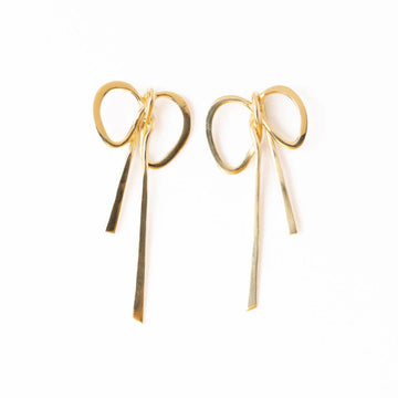 Gold bow post earrings by Katie, presented on a white background.