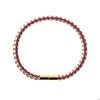 Leather braided bracelet with gold clasp.