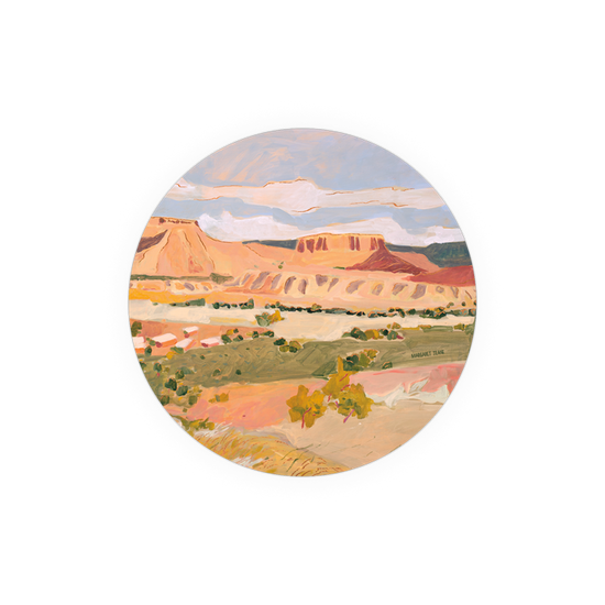 Landscape art coaster by Margaret Teare, featuring an array of desert tones and an oval shape.
