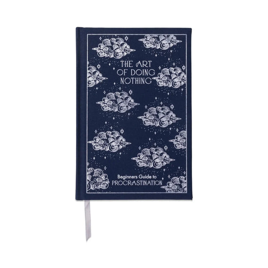 Blue "The Art of Doing Nothing" journal with cloud and star pattern, Beginner's Guide to Procrastination.