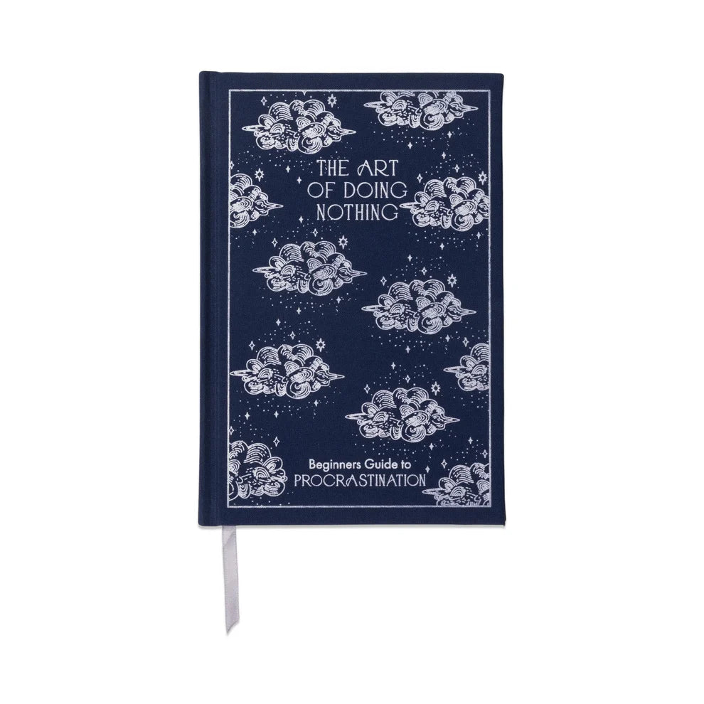Blue "The Art of Doing Nothing" journal with cloud and star pattern, Beginner's Guide to Procrastination.