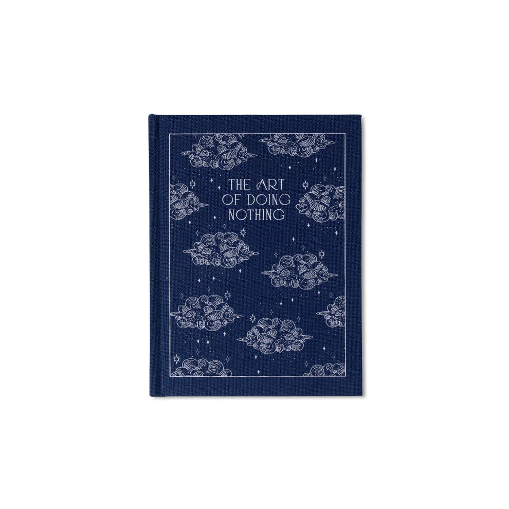 Blue bound notepad with "The Art of Doing Nothing" text, with a decorative cloud and star pattern.