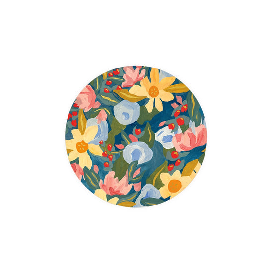 Floral printed coaster from Seedlings, showcasing flowers and berries in shades of pink, yellow, and blue.