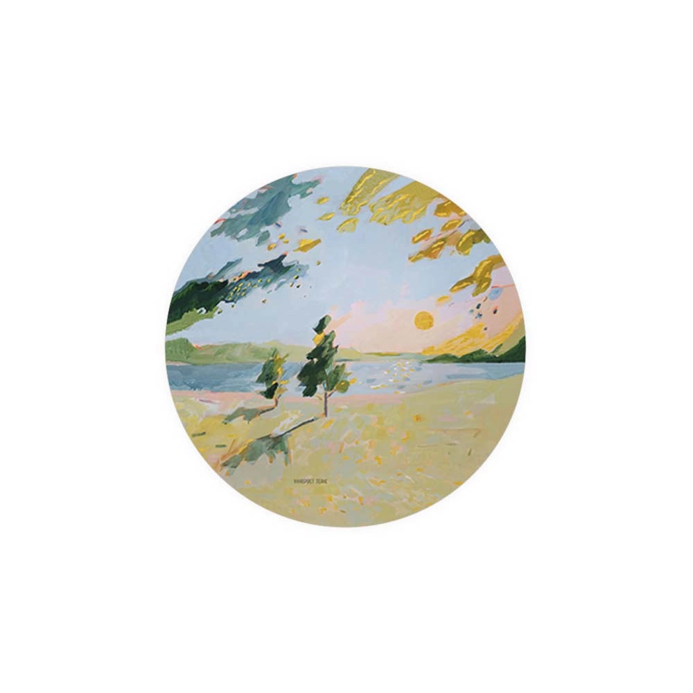 Round art coaster by Margaret Tolbert featuring a landscape painting of trees by a lake.
