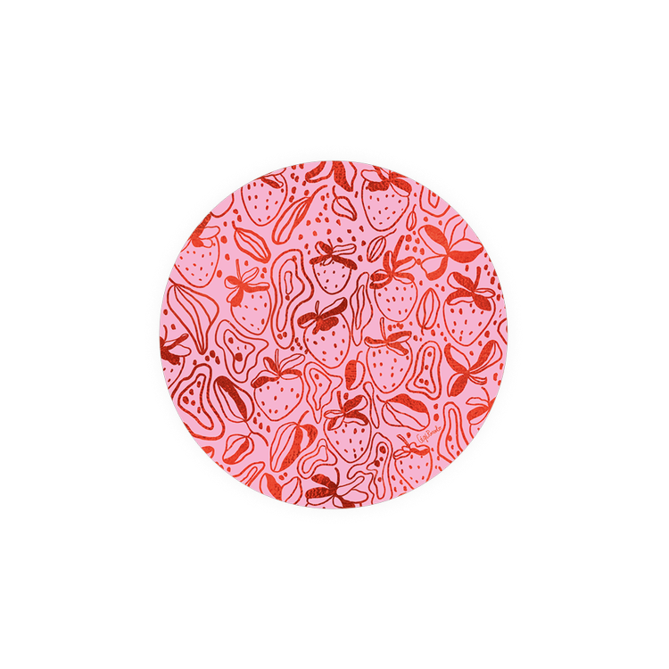 Patterned coaster with strawberries from Seedlings, with pink and red circular pattern.