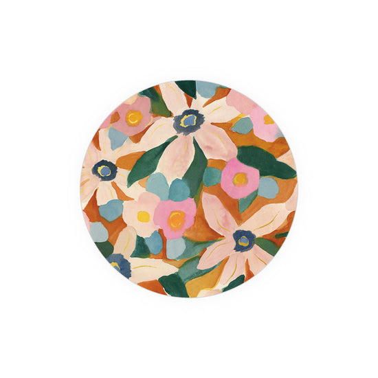 Floral patterned coasters by Margaret Tew featuring pink, blue, and green accents on an orange background.
