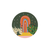 Decorative kitchen coaster with rainbow archway and desert plants.