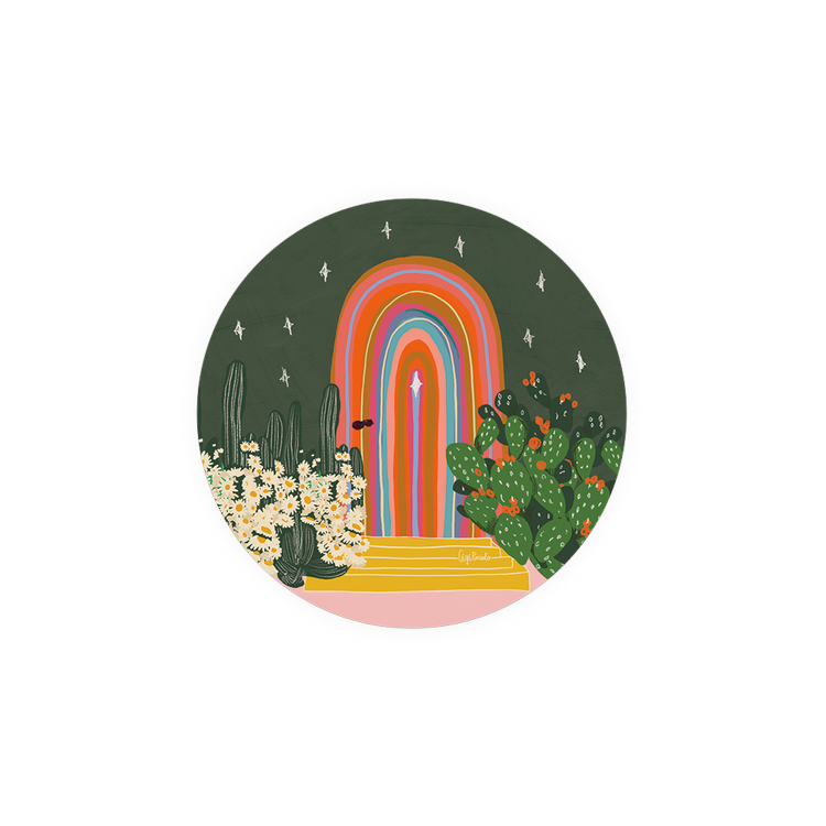 Decorative kitchen coaster with rainbow archway and desert plants.