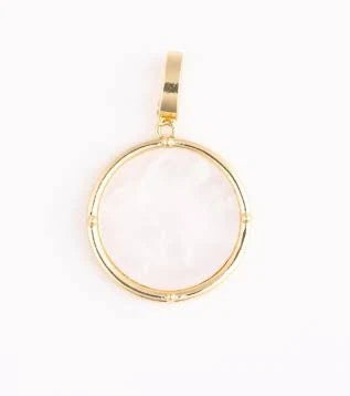 Gold coin charm for jewelry by Sophie, featuring a white stone center.
