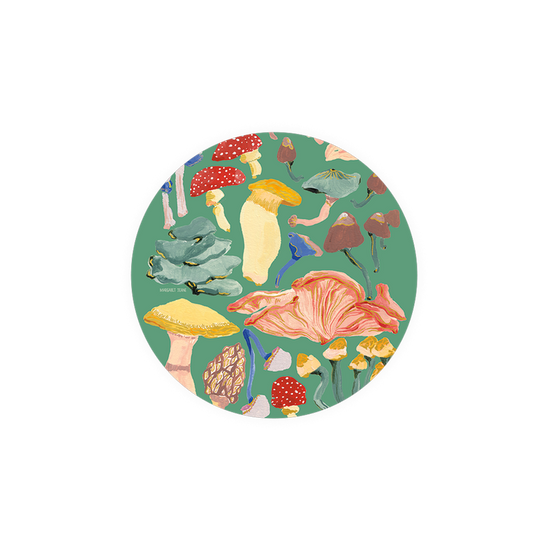 Colorful mushroom patterned coasters from Margaret Jeane, in a circular design against a green background.