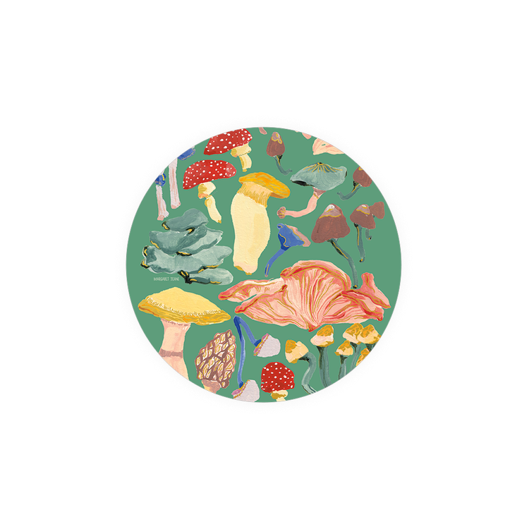 Colorful mushroom patterned coasters from Margaret Jeane, in a circular design against a green background.