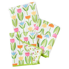 Set of three reversible mini towels with a floral print and green trim.