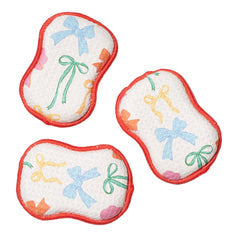 Set of three reusable sponges with a red trim and patterned bows.