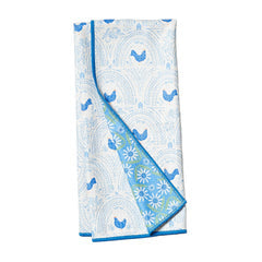 Reversible towel by Now Designs with a blue and white bird and arch pattern.