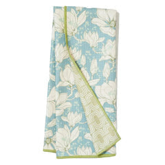 Reversible towel with floral pattern by Studio Oh! featuring a blue background with white flowers and green trim.