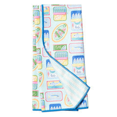 Reversible towel by Matouk featuring a colorful, all-over sardine can pattern.