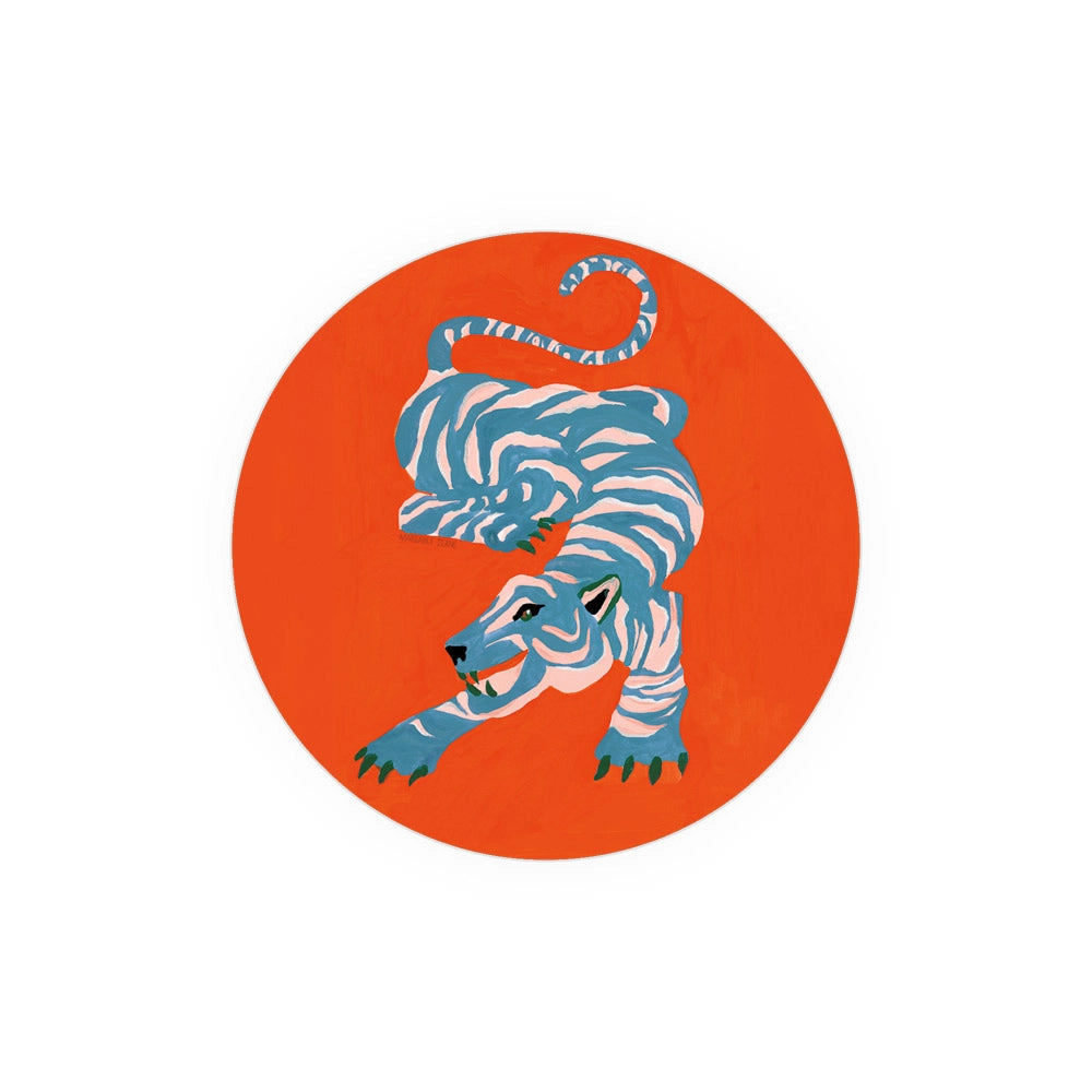 Decorative printed coaster with a blue and pink tiger design on an orange background.